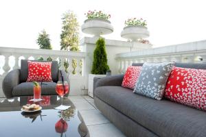 a living room with a couch and a table at Impérial Palace in Annecy