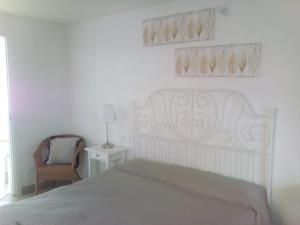 Postel nebo postele na pokoji v ubytování B&B AMaLu'