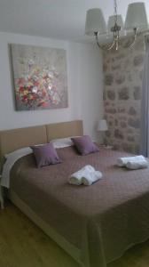Postel nebo postele na pokoji v ubytování Rilati palace Dubrovnik 3