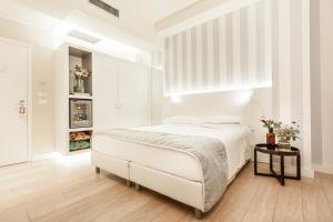 Cama ou camas em um quarto em Hotel Villa Rosa Riviera