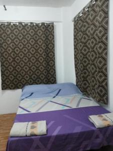 Ένα ή περισσότερα κρεβάτια σε δωμάτιο στο Budget Studio Unit in Makati