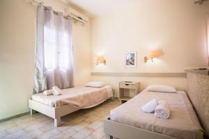 Postel nebo postele na pokoji v ubytování Theodora Corfu Holiday Apartments