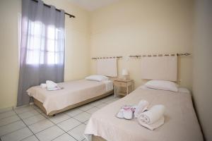 Postel nebo postele na pokoji v ubytování Theodora Corfu Holiday Apartments