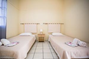 Postel nebo postele na pokoji v ubytování Theodora Corfu Holiday Apartments