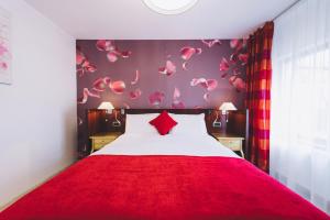 Postel nebo postele na pokoji v ubytování Derby Apart Hotel