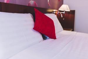 Postel nebo postele na pokoji v ubytování Derby Apart Hotel
