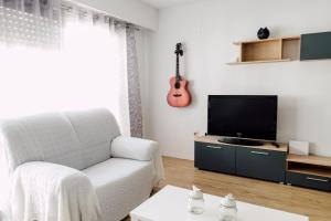 Televisyen dan/atau pusat hiburan di Apartamento Gandia Touriplaya +11 gambar