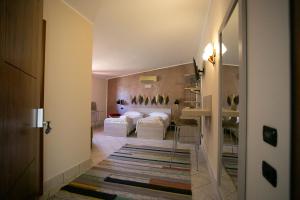 a hallway with two beds in a room at B&B Trepo in Tropea