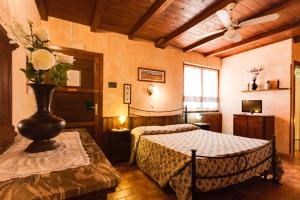 Postel nebo postele na pokoji v ubytování Agriturismo Casale Sasso