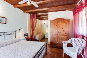 Postel nebo postele na pokoji v ubytování Agriturismo Casale Sasso