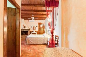 Postel nebo postele na pokoji v ubytování Agriturismo Casale Sasso + 37 fotografií