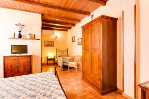 Postel nebo postele na pokoji v ubytování Agriturismo Casale Sasso