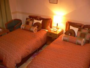 Postel nebo postele na pokoji v ubytování Hotel Villa Kuretake