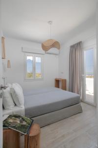 Ένα ή περισσότερα κρεβάτια σε δωμάτιο στο Naxos Infinity Villa and Suites +41 φωτογραφίες