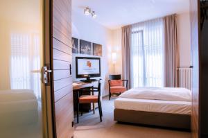 Llit o llits en una habitació de Hotel Begardenhof