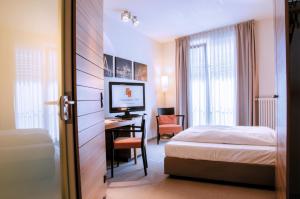 Postel nebo postele na pokoji v ubytování Hotel Begardenhof