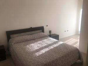A bed or beds in a room at Alle Torri