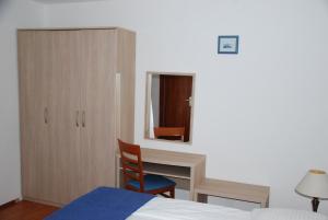 Postel nebo postele na pokoji v ubytování Apartmani Dragica