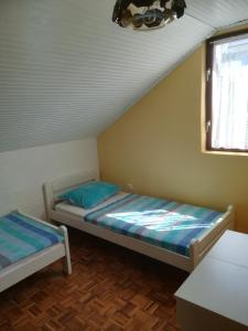 Postel nebo postele na pokoji v ubytování Apartmani Mataija