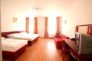 Posteľ alebo postele v izbe v ubytovaní Apart Hotel Susa