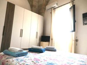 Postel nebo postele na pokoji v ubytování Casa Terrazzata in centro