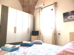 Postel nebo postele na pokoji v ubytování Casa Terrazzata in centro