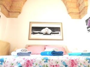 Postel nebo postele na pokoji v ubytování Casa Terrazzata in centro