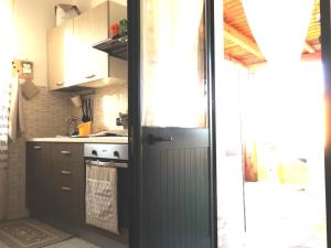 Kuchyň nebo kuchyňský kout v ubytování Casa Terrazzata in centro