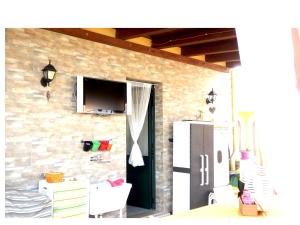 TV a/nebo společenská místnost v ubytování Casa Terrazzata in centro
