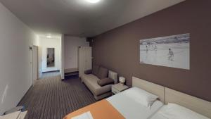 Postel nebo postele na pokoji v ubytování Hotel Belveder