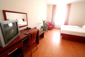 Posteľ alebo postele v izbe v ubytovaní Apart Hotel Susa