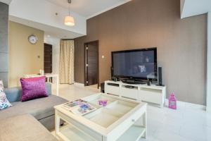 
A television and/or entertainment center at 1 Bedroom Apartment in Cayan Tower by Deluxe Holiday Homes
