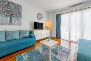 Un televizor și/sau centru de divertisment la Rovinj Turquoise Studio Apartment