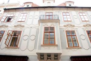 a large building with a large window at Hotel U Zlateho jelena in Prague
