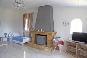 A television and/or entertainment centre at Calypso Apartments