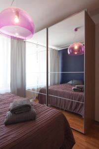 a bedroom with two beds and two pink lights at Bajka 09 -Self Check - Free parking in Bratislava