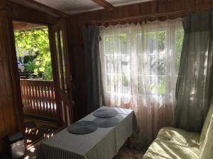 a room with a table with two hats on it at Domek Letni Bałtycka in Sopot