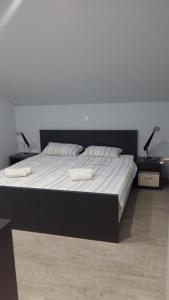 Postel nebo postele na pokoji v ubytování Apartments Sovran Vila Marija