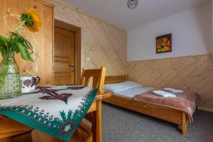 Postel nebo postele na pokoji v ubytování Willa Lassakówka