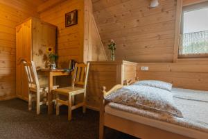 Postel nebo postele na pokoji v ubytování Willa Lassakówka