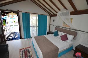 Postel nebo postele na pokoji v ubytování Blu Brezza Marine Hotel