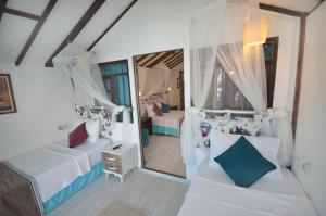 Postel nebo postele na pokoji v ubytování Blu Brezza Marine Hotel