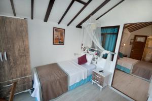 Postel nebo postele na pokoji v ubytování Blu Brezza Marine Hotel