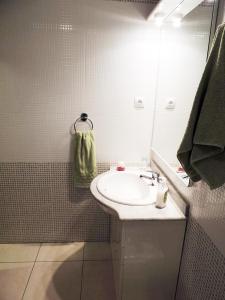 a bathroom with a sink and a mirror at Alojamiento turistico Ribagorza in El Lligallo del Gànguil