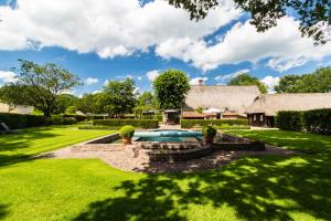 an estate with a swimming pool in a yard at Hoeve de Eshof in Norg