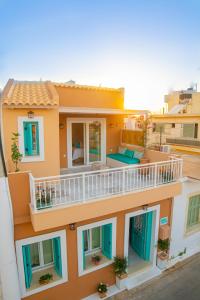 a view of a house with a balcony at MaVi House Old Town in Malia