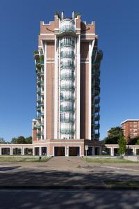 a large building with a tall building at Bed End Breakfast Mary's Tower in Bologna