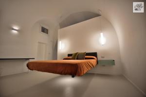 Krevet ili kreveti u jedinici u objektu Corte Cairoli B&B and Suites