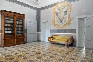 A bed or beds in a room at Dimora Duchessina Suites de Charme