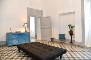 A bed or beds in a room at Dimora Duchessina Suites de Charme